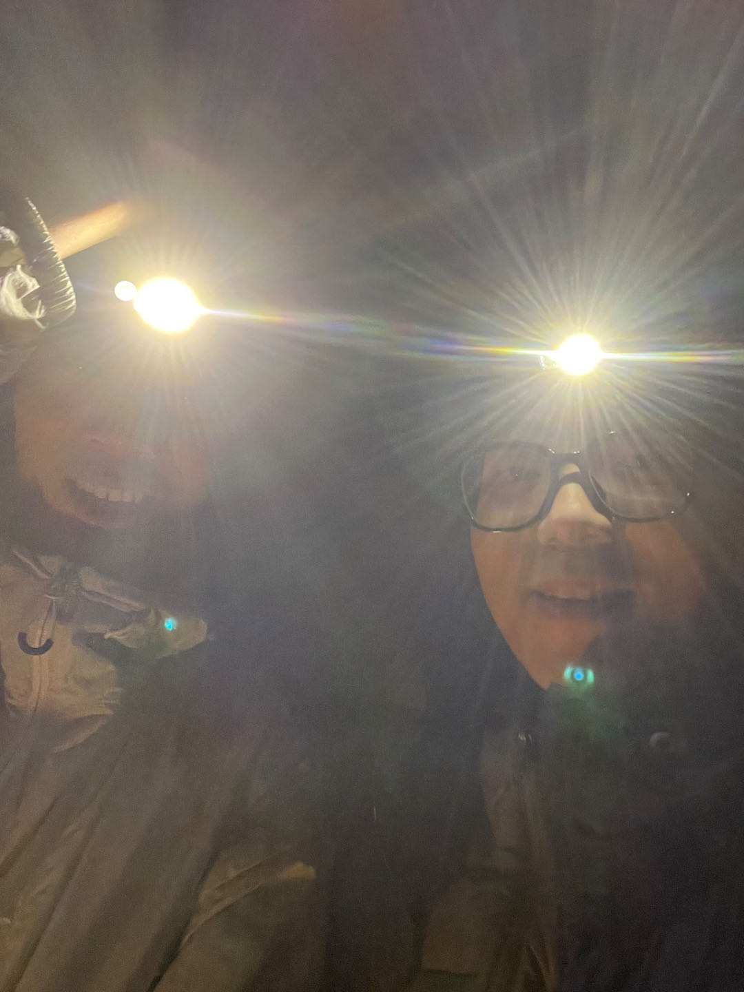 Shaoda and I setting up the tent with headlamps